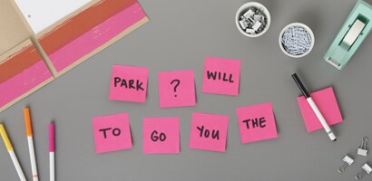 Post-it® Super Sticky Note, on table showing words on them to mix around and make a sentence export slide to student to arrange into sentence.
